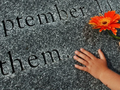 September 11 Memorial with hand holding flower