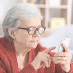 Older woman looking at a cellphone 