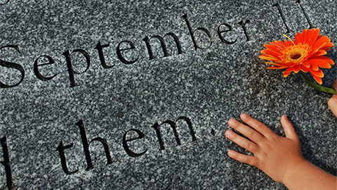 September 11 Memorial with hand holding flower
